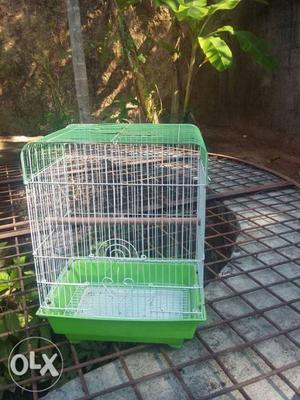Green And White Metal Bird Cage