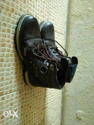 Pair Of Black Leather Buckled Boots
