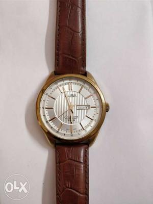 Seiko Alba golden dial watch brown leather strap