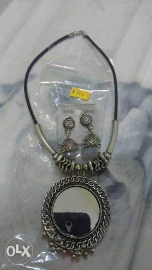 Silver-colored And Black Necklace And Earrings
