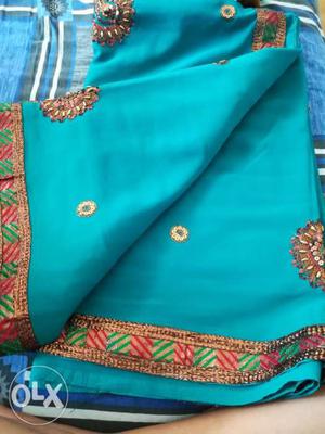 Teal, Red, And Green Textile