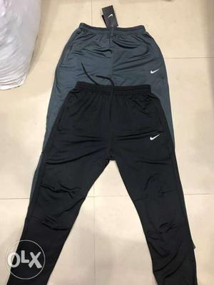 Two Black And Gray Nike Pants