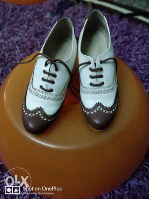 White-and-brown Leather Wingtip Shoes
