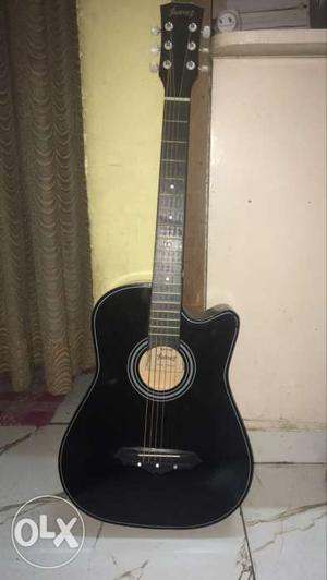 Black And Gray Acoustic Guitar