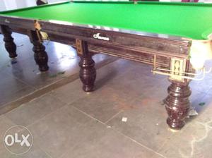Brand new and old snooker tables