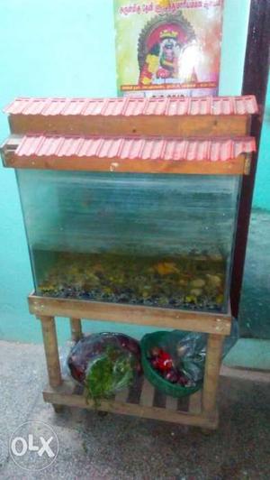 Fish tank with a wooden stand