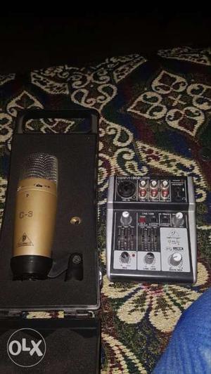 Gold-colored C-9 Condenser Microphone And Audio Mixer
