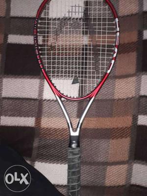 Gray And Red Head Tennis Racket