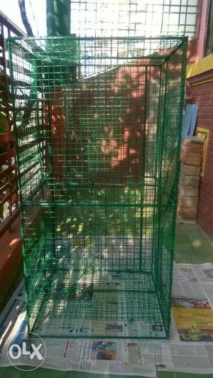 Iron cage of heavy build.. height 4..width 1.5 ft