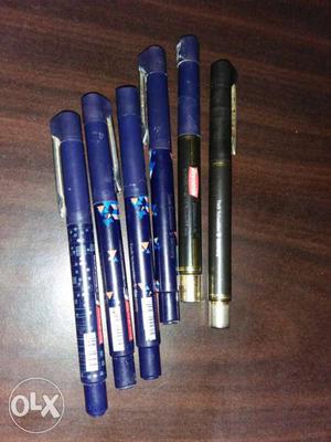 Six Blue And Black Pens