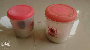 Two White-and-red Plastic Jars With Lids