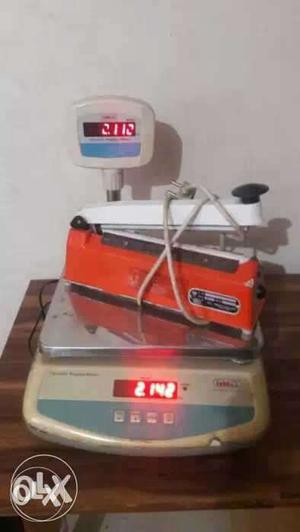 White And Red Heat Sealer And White Digital Scale
