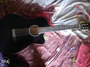 Black And Brown Wooden Cutaway Acoustic Guitar