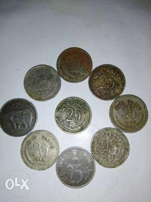 Nine Silver-colored 25 Indian Paise Coins