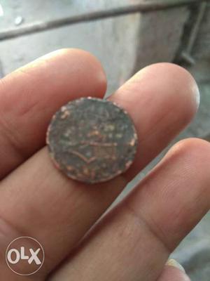 Round Copper-colored Nawaganar Coin