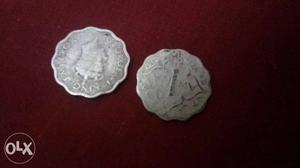 Two Scalloped Edge Silver-colored Coins