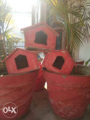 Three Red Wooden bird Houses