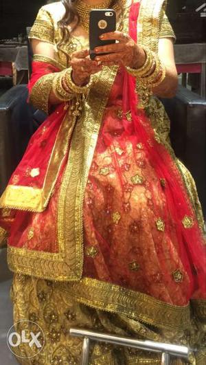 Bridal golden lehenga with red dupatta