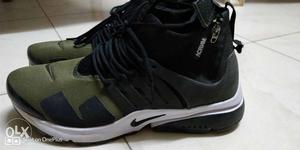 Pair Of Black-and-green Nike Basketball Shoes