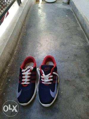 Pair Of Black-and-red Nike Athletic Shoes fixed price size 7