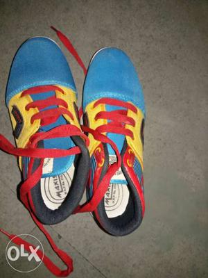 Pair Of Blue-and-yellow Low-top Sneakers