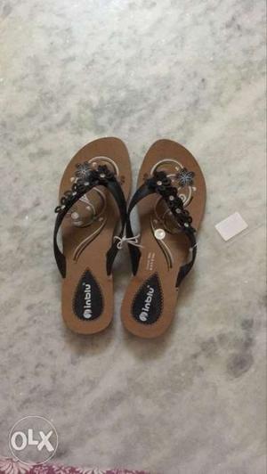 Pair Of Brown-and-black Floral Leather Sandals