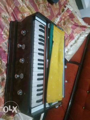 Brown And White Electronic Keyboard