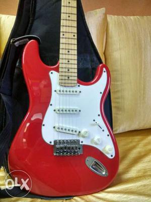 Red electric Java guitar one year old in top