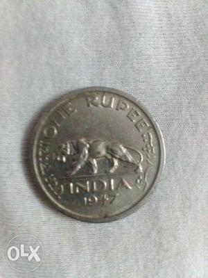 Round Silver-colored One Rupee  Coin