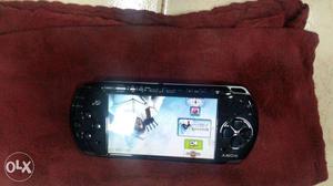 Psp with 25 games in good condition...courier services