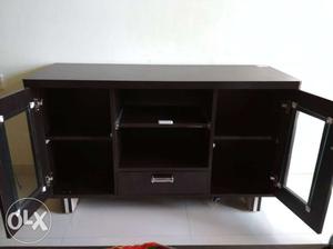 Unused tv cabinet with a drawer and shelves