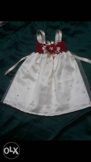 New customised red with cream colour baby frock... age 0 to