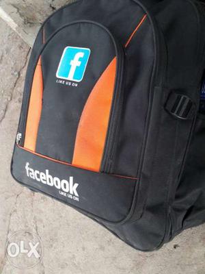 Orange And Black Facebook Print Backpack