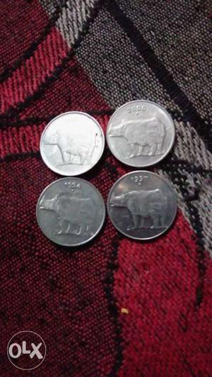 4 round shaped silver color 25 paise coins