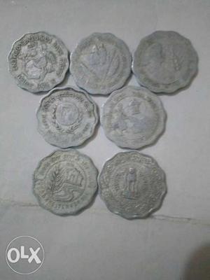 7 coins of 10 paisa issued at different occasions