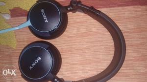 Black And Gray Sony Corded Headphones