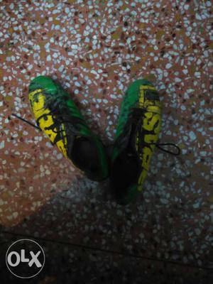 Black-yellow-and-green Soccer Cleats