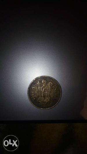 Golden coin,, twenty paise coin.