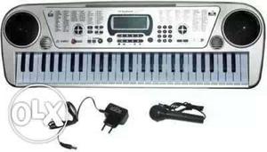 Gray Electronic Keyboard With Microphone And Adapter