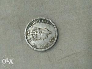 Man's Profile Round Silver-colored Coin
