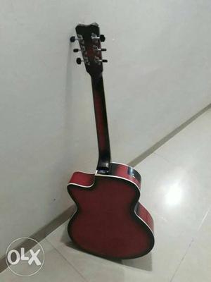 Red And Brown Cutaway Acoustic Guitar