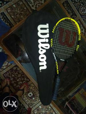 Yellow And Black Wilson Tennis Racket With Black Case