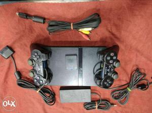PlayStation 2 with accessories and 2 cds free # courier