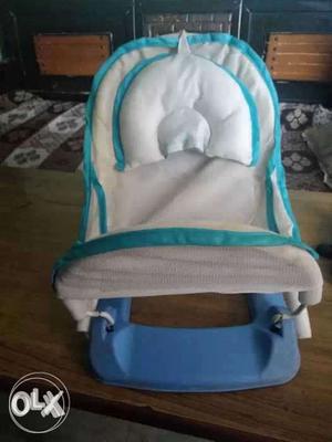 Baby's White And Blue Bouncer