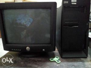 Black CRT computer with CPU UPS mouse And keyboard.