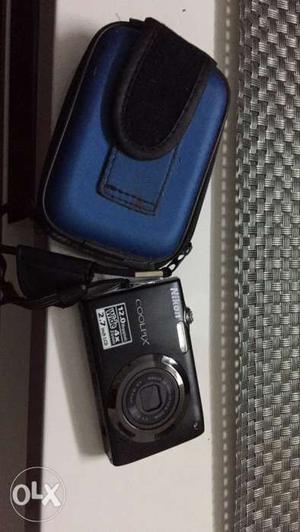 Black Nikon Coolpix Compact Camera With Blue Case