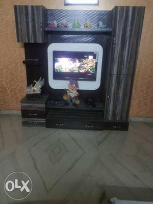 Brown Wooden TV Stand With CRT Television