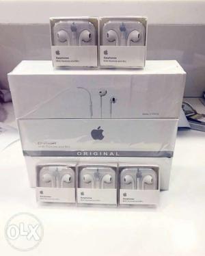 Several Apple Earpods With Cases