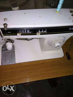 White And Black Singer Electric Sewing Machine