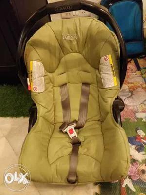 Baby's Green Graco Car Seat Carrier in good condition